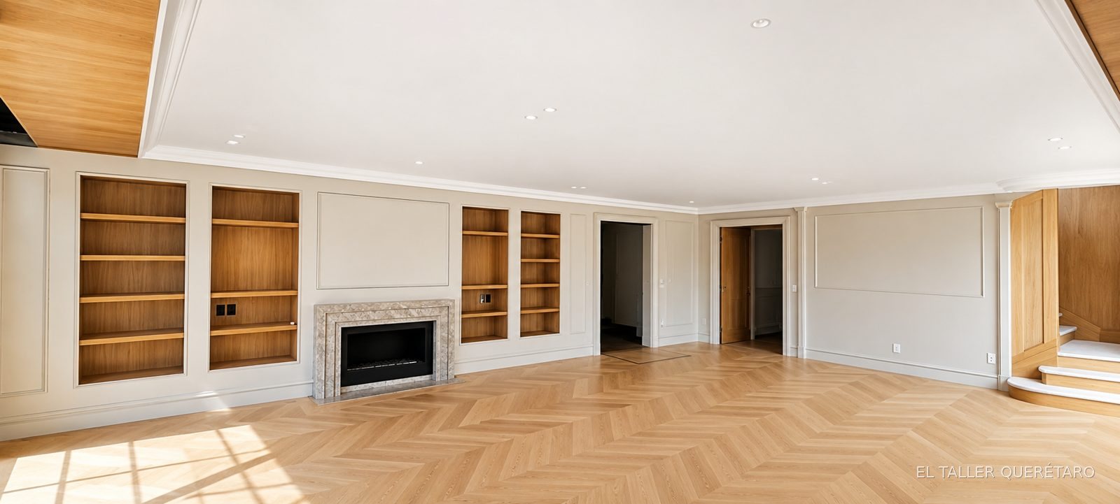 Sala con libreros laqueados en blanco mate a ambos lados de la chimenea